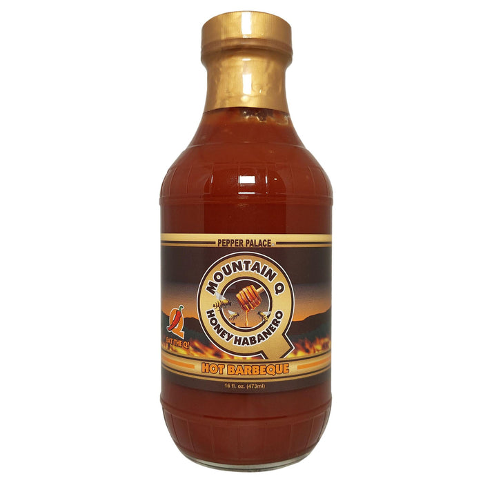Bottle of Mountain Q Honey Habanero Hot Barbeque sauce on a white background