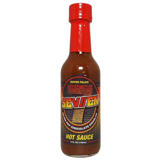 Bottle of Seven Hot Sauce with a red cap on a white background