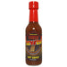 Bottle of Seven Hot Sauce with a red cap on a white background