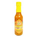 Bottle of Curry On hot sauce with a yellow cap on a white background
