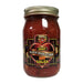 Jar of sweet black bean and corn hot salsa with a label on a white background