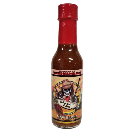 Hot sauce bottle with red cap and label featuring a skull and crossbones design on a white background