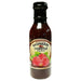 Bottle of Raspberry Chipotle sauce with a label on a white background