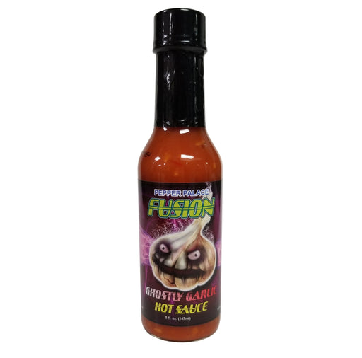 Bottle of Ghostly Garlic Hot Sauce with a colorful label on a white background