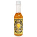 Bottle of hot sauce with a yellow label on a white background