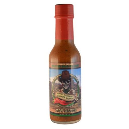 Hot sauce bottle with a red cap on a white background