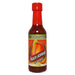 Bottle of Pepper Palace Peach Serrano hot sauce on a white background