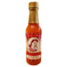 Hot sauce bottle with a red label featuring a vintage-style illustration on a white background