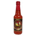 Bottle of hot sauce with a red cap on a white background