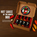 Hot sauce of the month box with question marks on bottles and Pepper Palace branding.