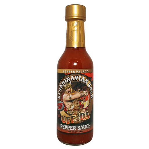 Bottle of Off Da Pepper Sauce with gold cap on a white background