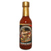 Bottle of Off Da Pepper Sauce with gold cap on a white background