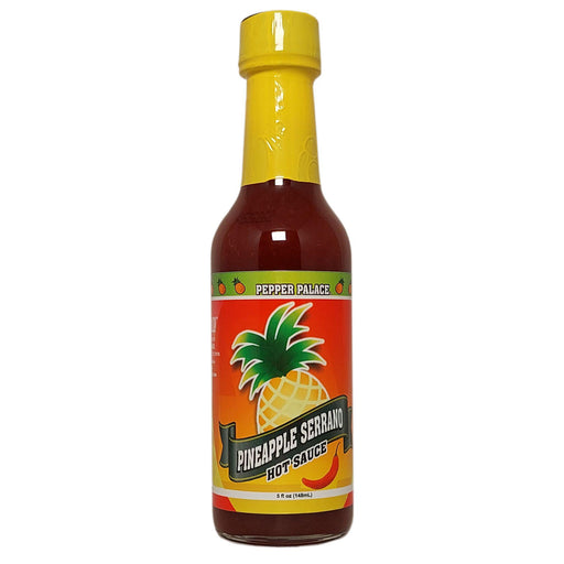 Bottle of Pineapple Serrano hot sauce with a yellow cap on a white background