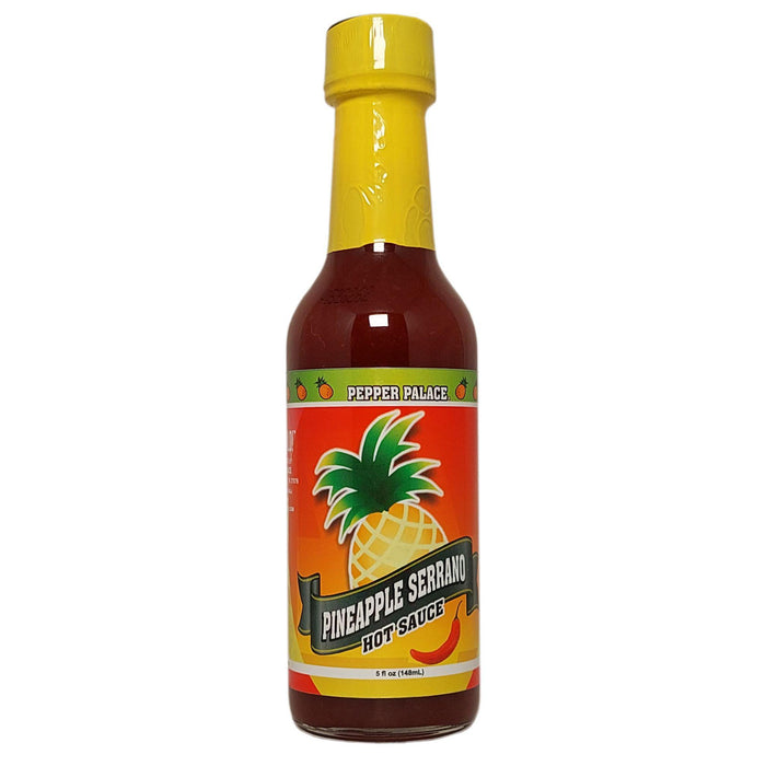 Bottle of Pineapple Serrano hot sauce with a yellow cap on a white background