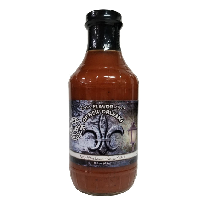 Bottle of sauce with a label on a white background