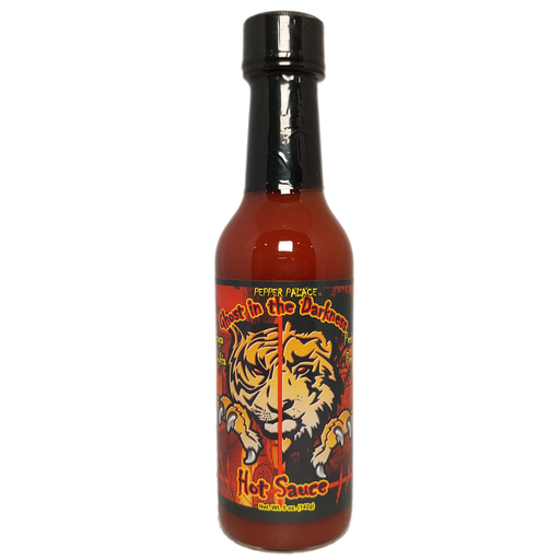 Hot sauce bottle with tiger design on a white background