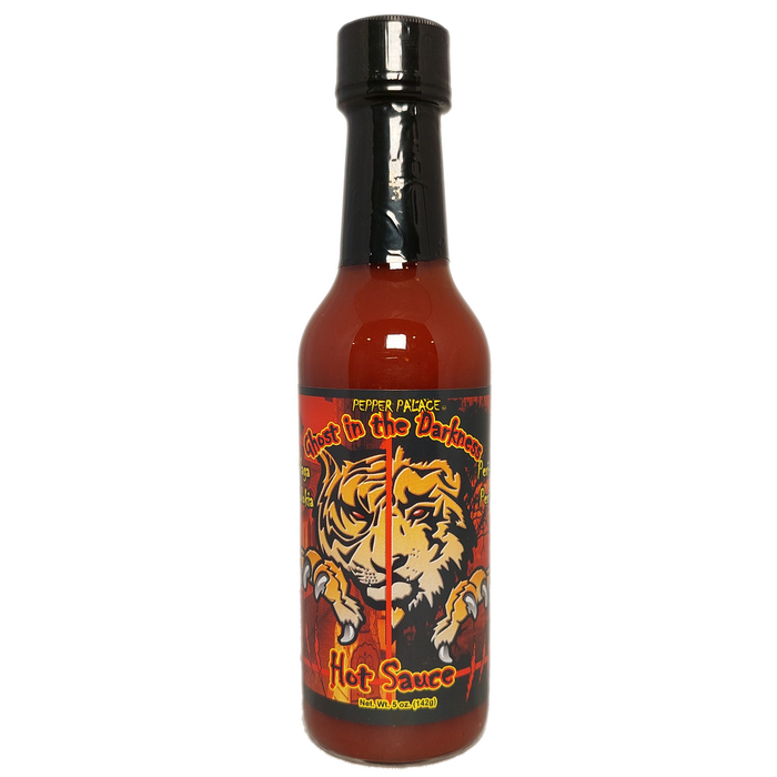 Hot sauce bottle with tiger design on a white background