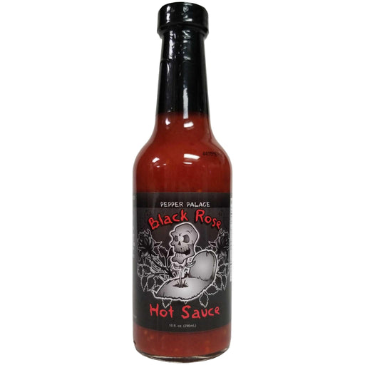 Bottle of Black Rose Hot Sauce with a skull design on a white background
