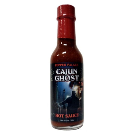 Bottle of Cajun Ghost hot sauce on a white background