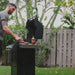 honey chipotle rum being put on grilling food